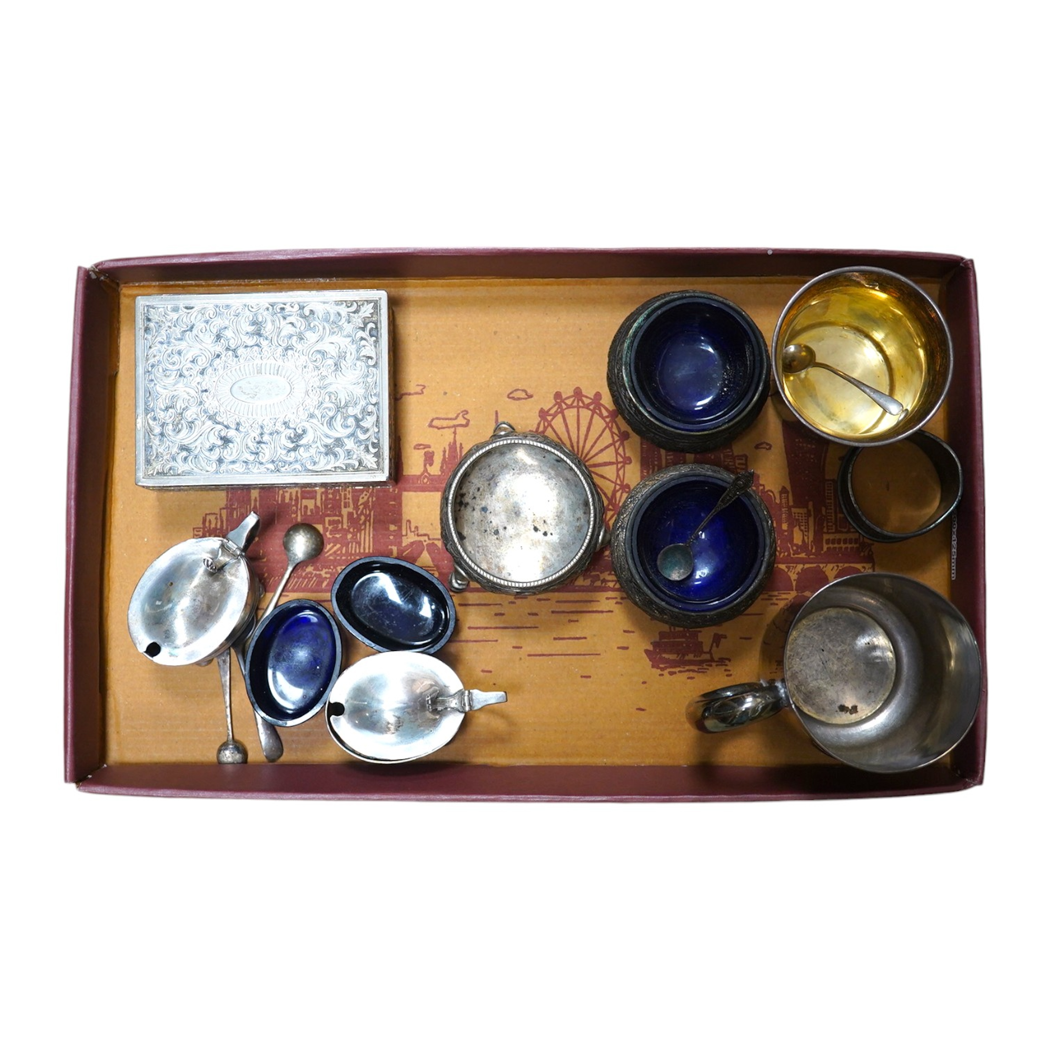 A group of assorted small silverwares including a christening mug, three salts and a pair of mustard pots, 11.5 oz of weighable silver. Condition - fair